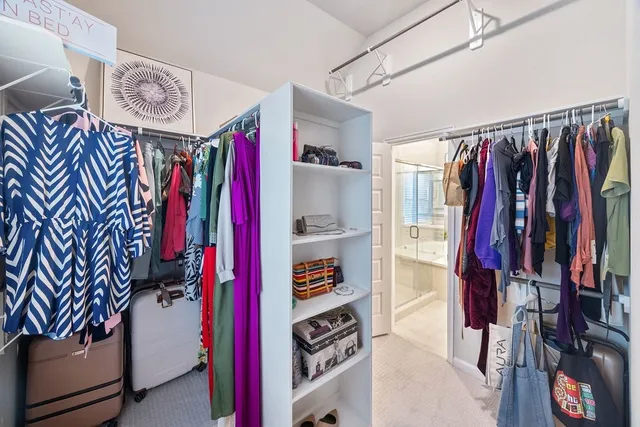 a bathroom with a sink and mirror with toilet