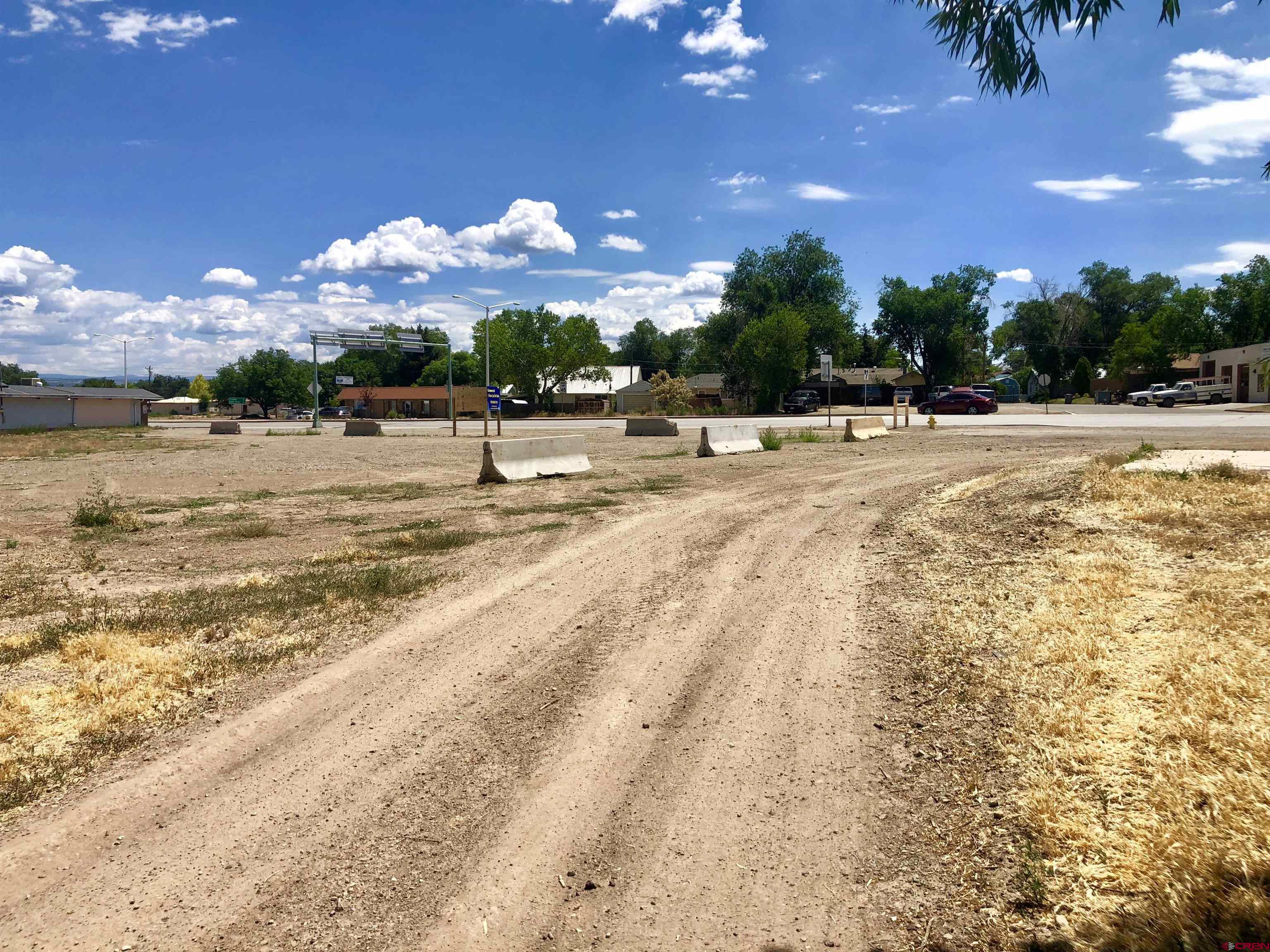 409 North Broadway Cortez, CO 81321 - Photo 11 of 13 a view of a swimming pool with an outdoor space and seating area