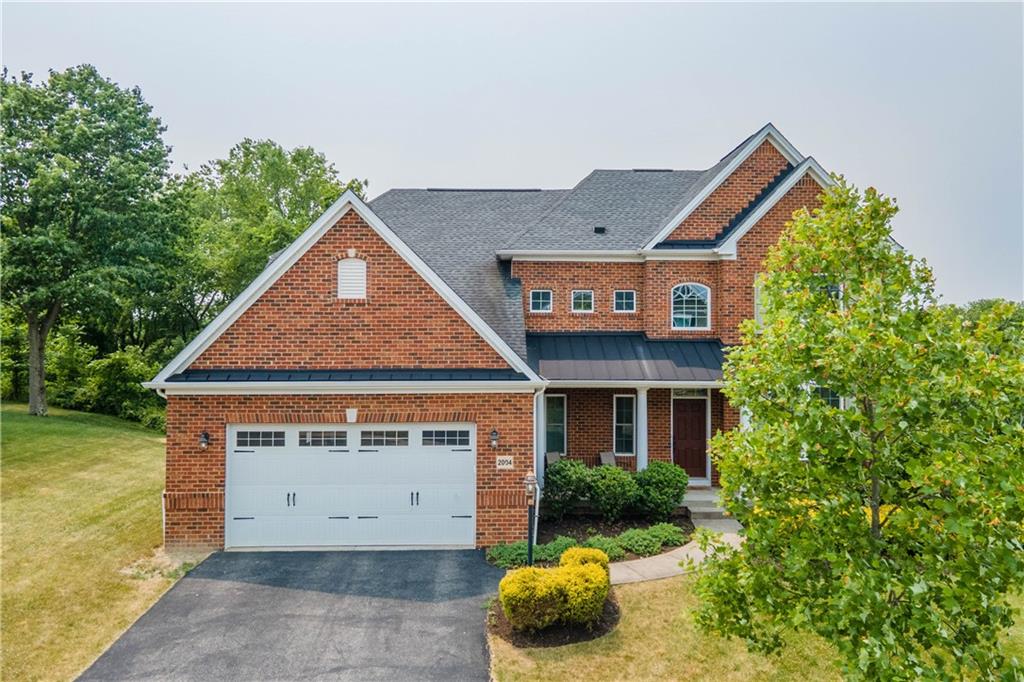 2004 Berkley Ridge Drive McDonald, PA 15057 - Photo 1 of 37 a front view of a house with a garden