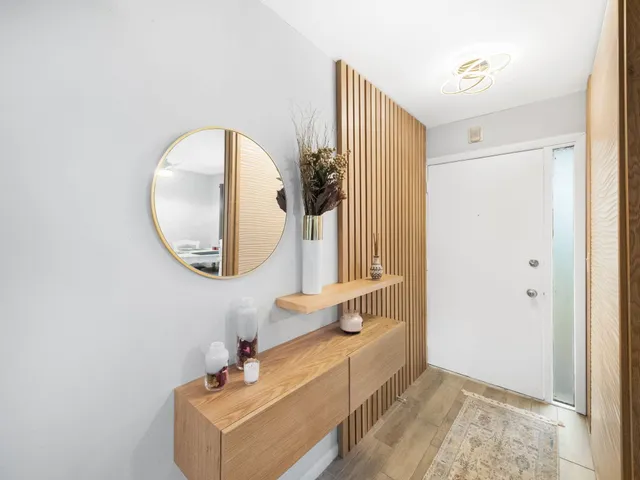 a bathroom with a sink mirror and vanity