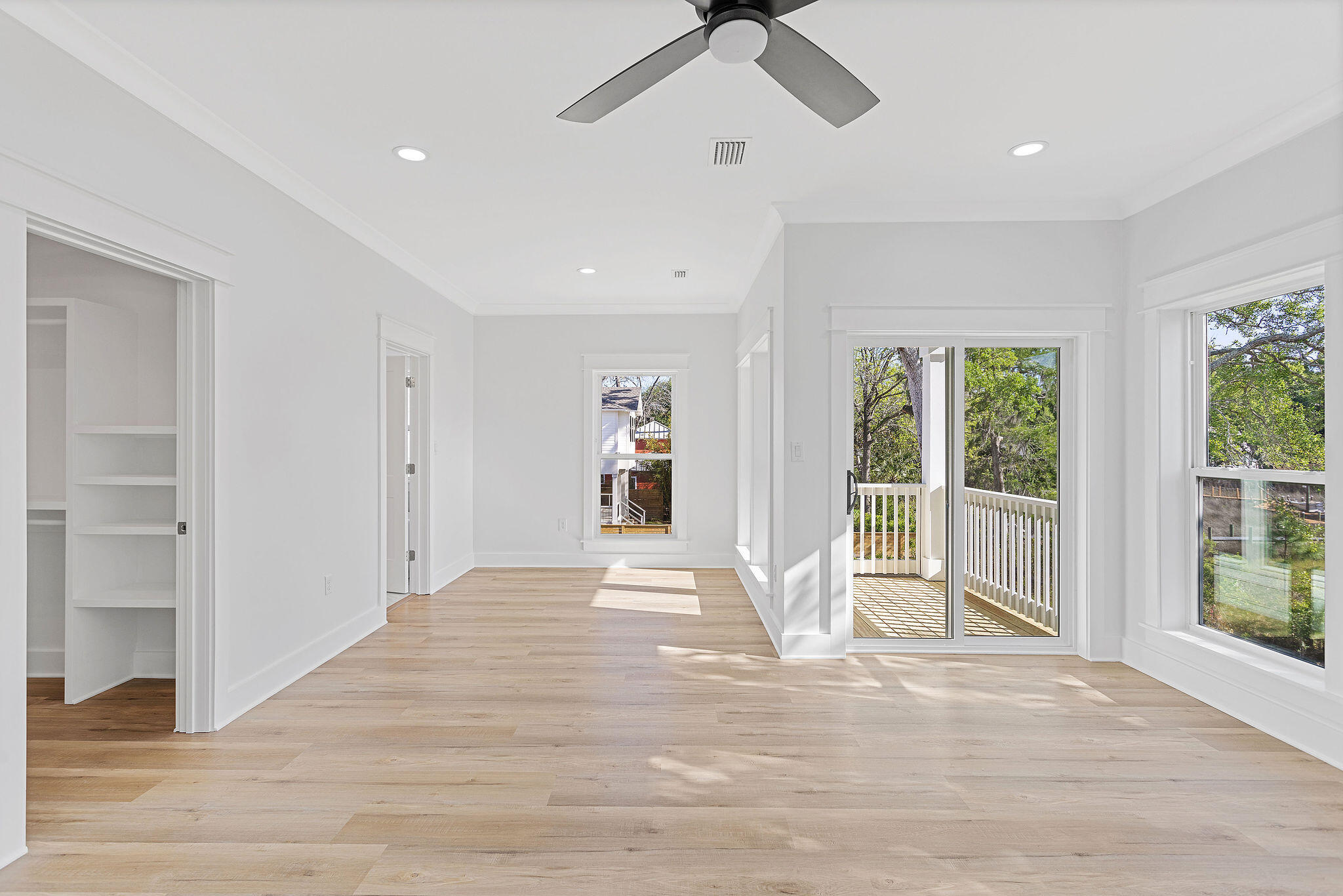 164 Rearden Way Santa Rosa Beach, FL 32459 - Photo 33 of 54 a view of a livingroom with wooden floor and a ceiling fan