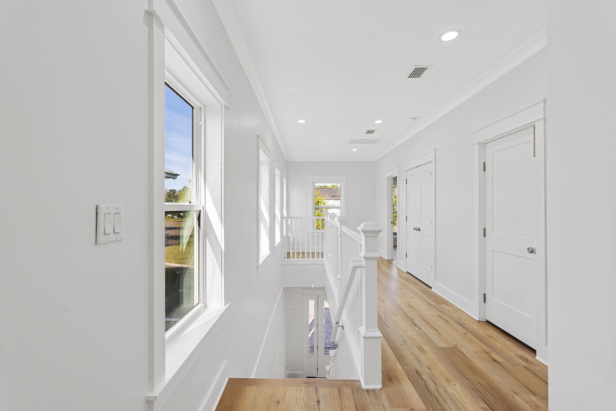 164 Rearden Way Santa Rosa Beach, FL 32459 - Photo 42 of 54 a view of a hallway with wooden floor and dining room