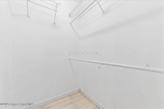 a view of a room with racks on the wall