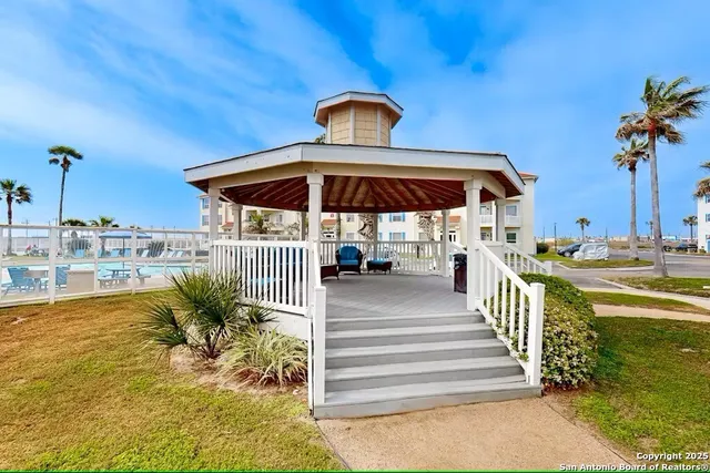 a view of a swimming pool with a lounge chairs