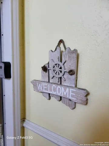a view of a room with a wooden door