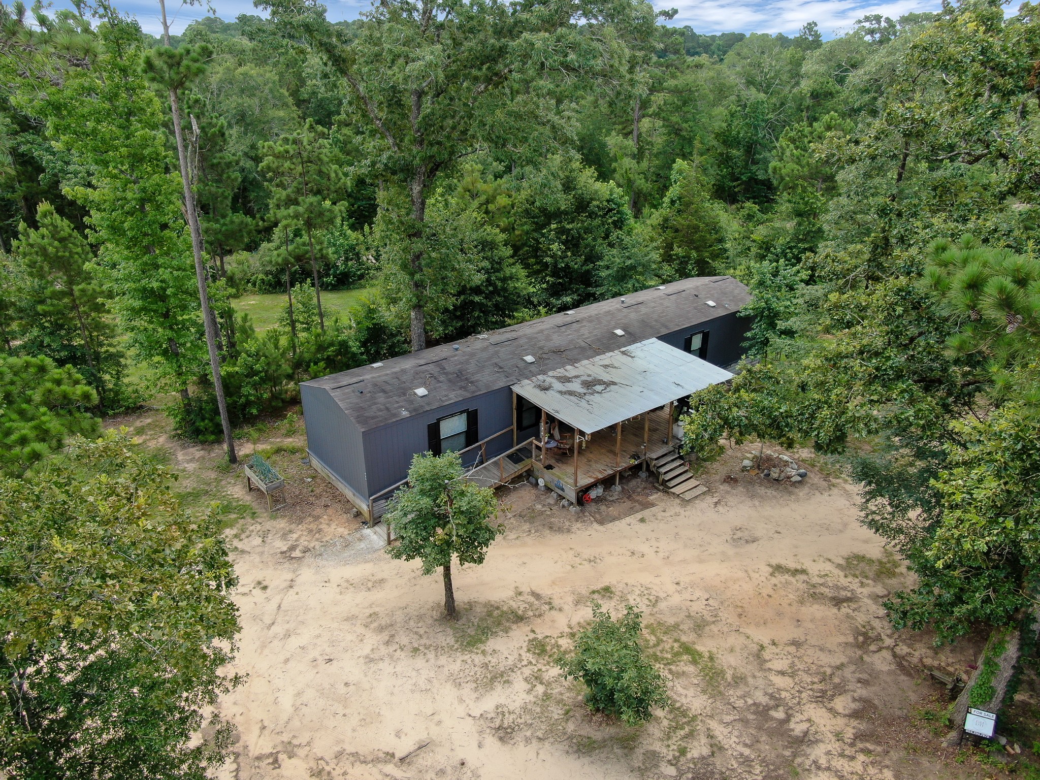 400 Raven Hill Road Oakhurst, TX 77359 - Photo 7 of 45 an aerial view of a house with a yard