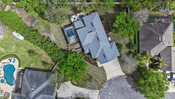 a view of a house with a yard and plants