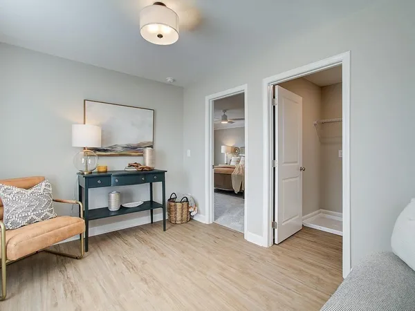 a view of a livingroom with furniture and wooden floor