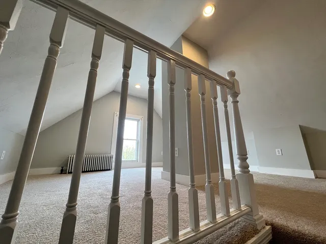 a view of staircase with rug floor