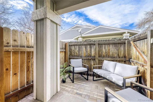 a patio with patio couch and table