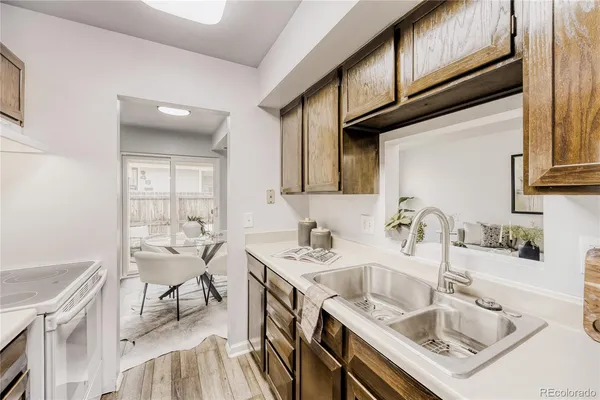 a kitchen with a sink cabinets and furniture