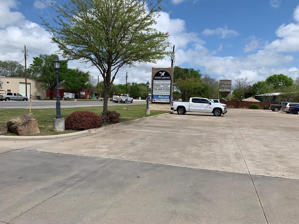206 Highway 342, Unit K Red Oak, TX 75154 - Photo 2 of 14 a view of street with parked cars