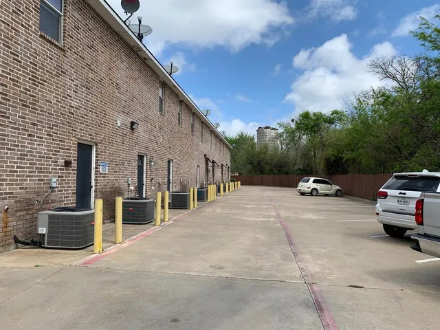 a view of car parked in front of house