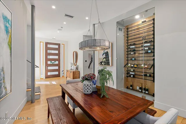 an aerial view of a house with a yard and potted plants