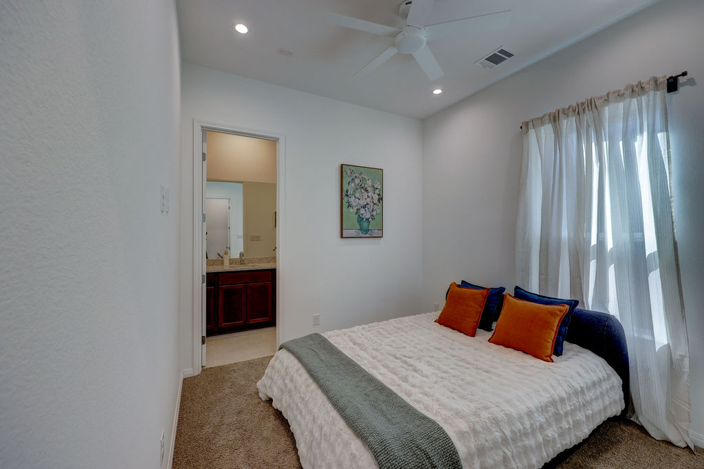 351 Pigeon River Road Kyle, TX 78640 - Photo 28 of 40 1st floor fan, recessed lighting, and ensuite bathroom