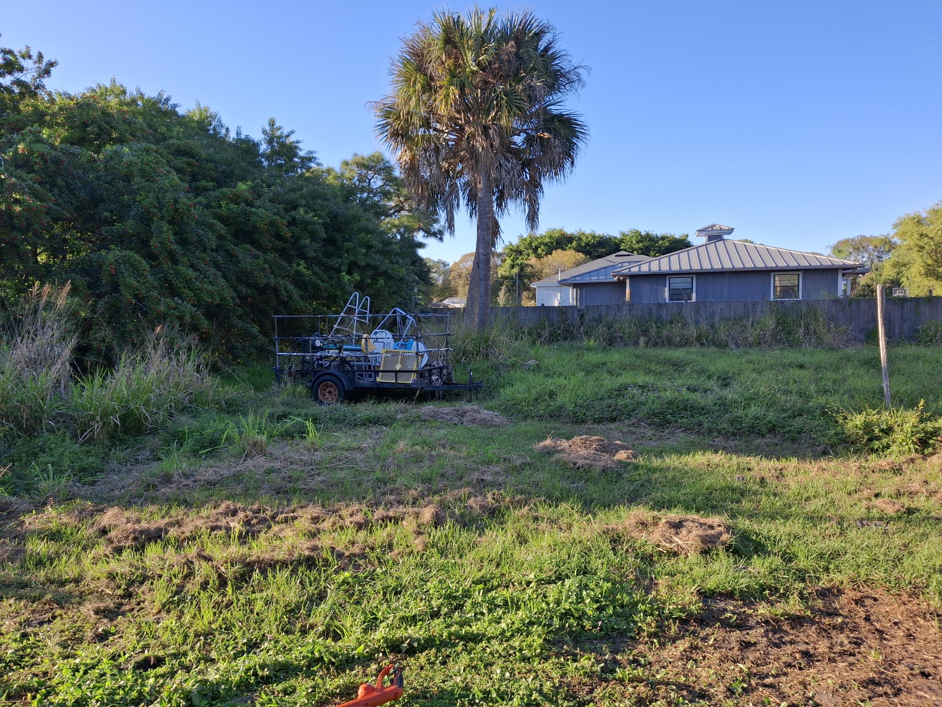 Undisclosed Address Fort Pierce, FL 34982 - Photo 2 of 2 a view of a garden with a building in the background