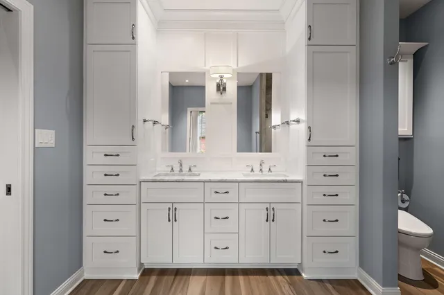 a bathroom with a double vanity sink and mirror
