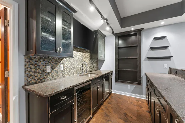 a kitchen with a stove and a refrigerator