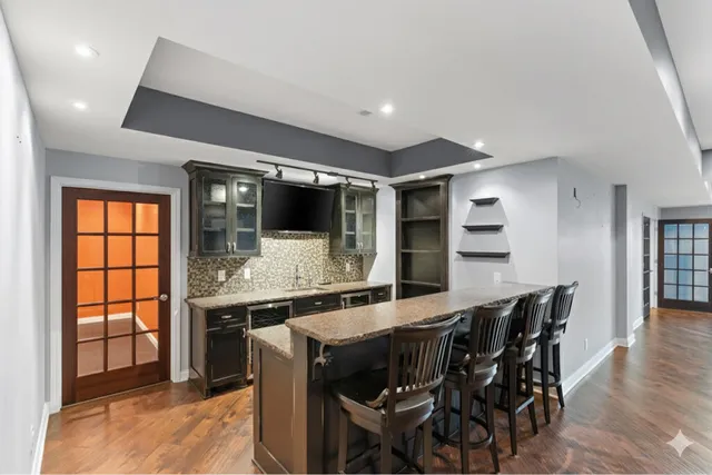 a kitchen with a table and chairs in it