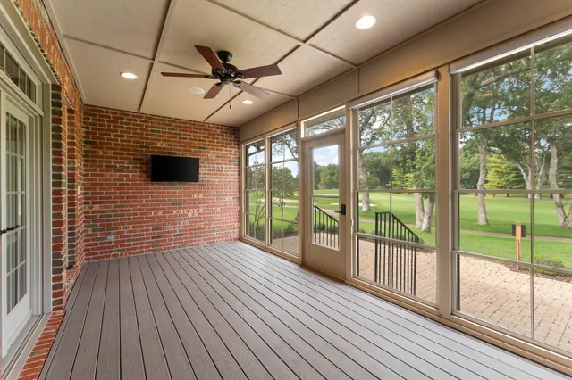 a view of outdoor space with wooden floor and windows