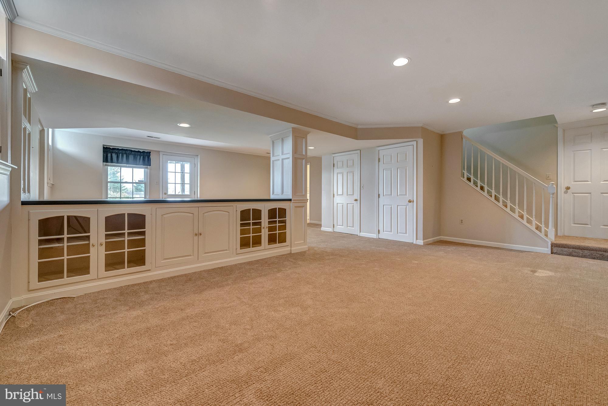 16902 Hoskinson Road Poolesville, MD 20837 - Photo 26 of 30 Built-ins separate the couches from the game space