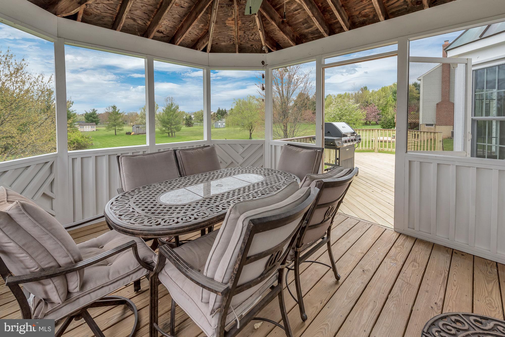 16902 Hoskinson Road Poolesville, MD 20837 - Photo 6 of 30 Screened-in porch for summer dinners!