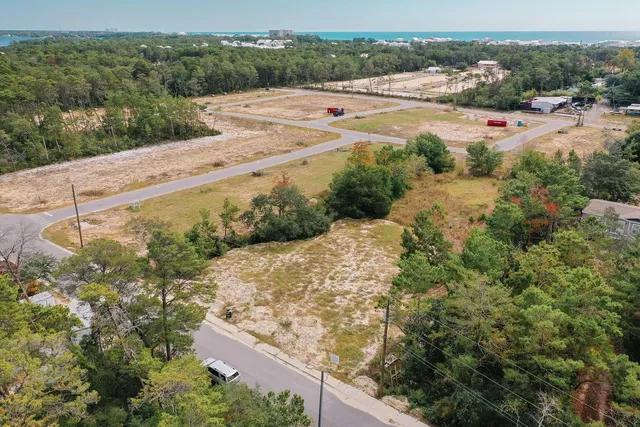 an aerial view of mountain with yard