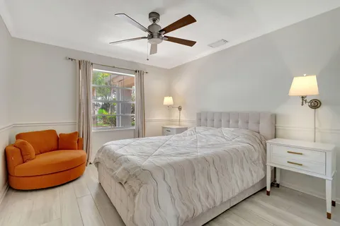 a bedroom with a bed a couch and a couch