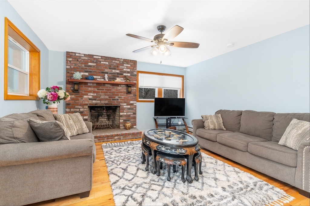 97 3rd Street North Edgartown, MA 02539 - Photo 15 of 27 a living room with furniture a fireplace and a flat screen tv