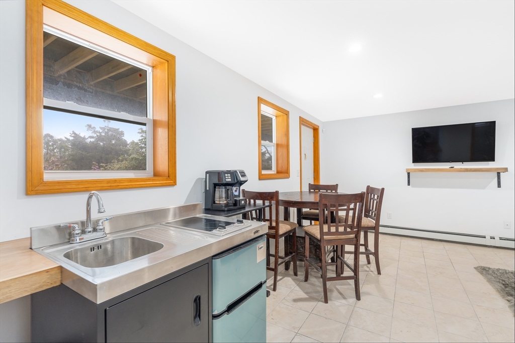 97 3rd Street North Edgartown, MA 02539 - Photo 18 of 27 a view of a dining room with furniture and window