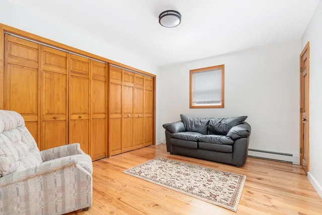 a living room with furniture and a rug