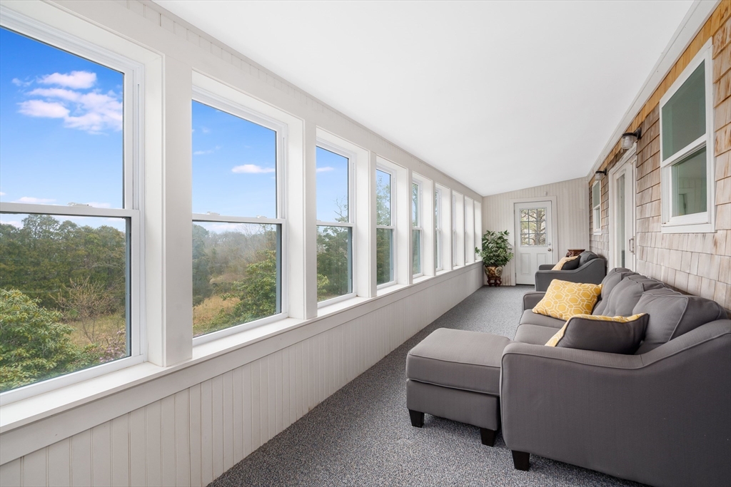 97 3rd Street North Edgartown, MA 02539 - Photo 26 of 27 a living room with furniture and a large window