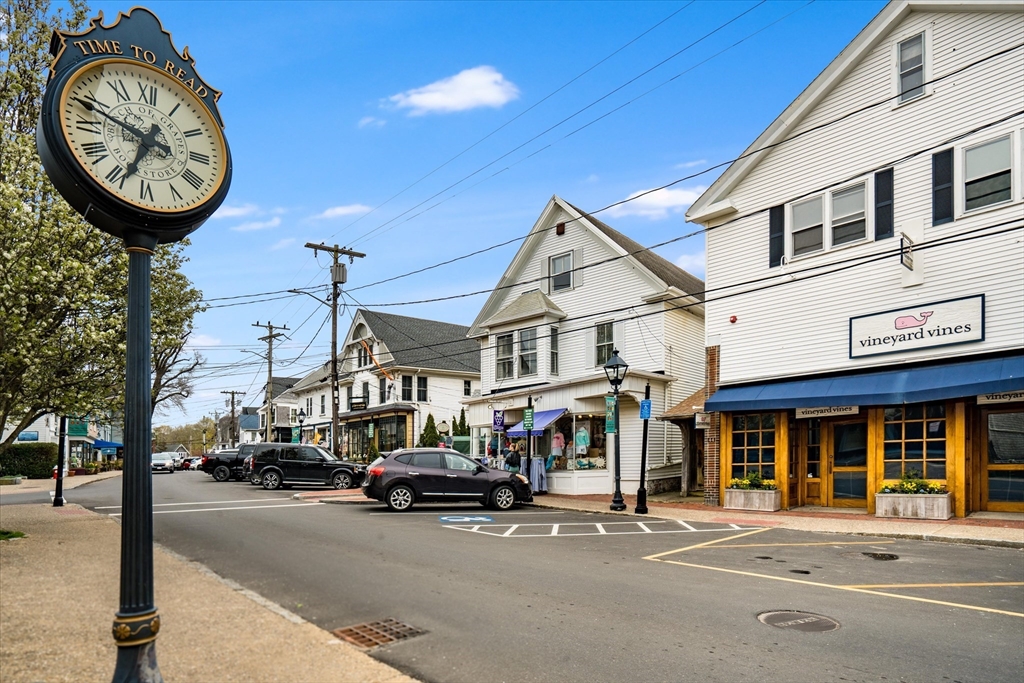 97 3rd Street North Edgartown, MA 02539 - Photo 10 of 27 a front view of a building with a parking lot of cars parked