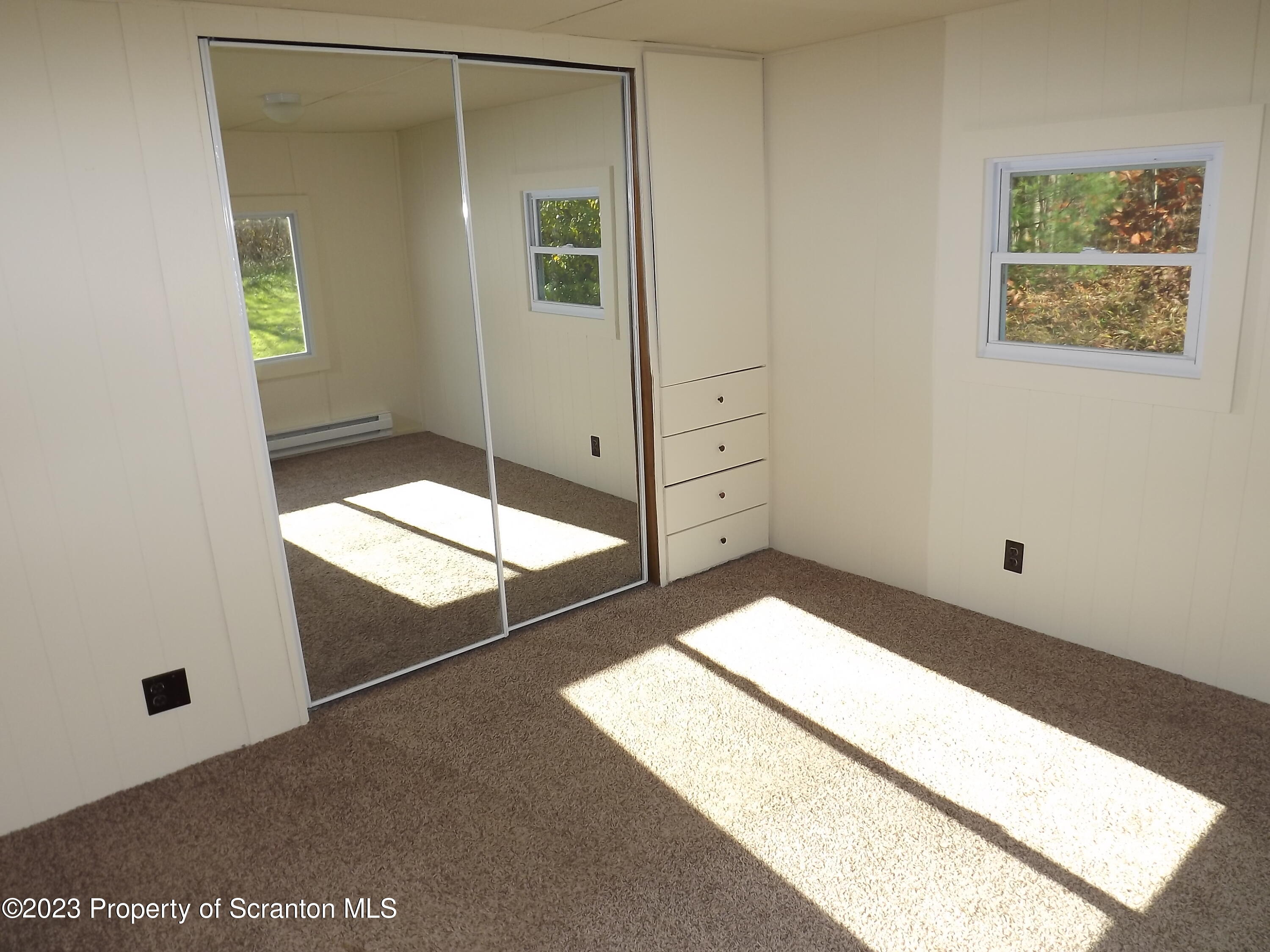 940 Nowlan Road, Unit 43 Port Crane, NY 13833 - Photo 12 of 13 a bathroom with a shower and a sink