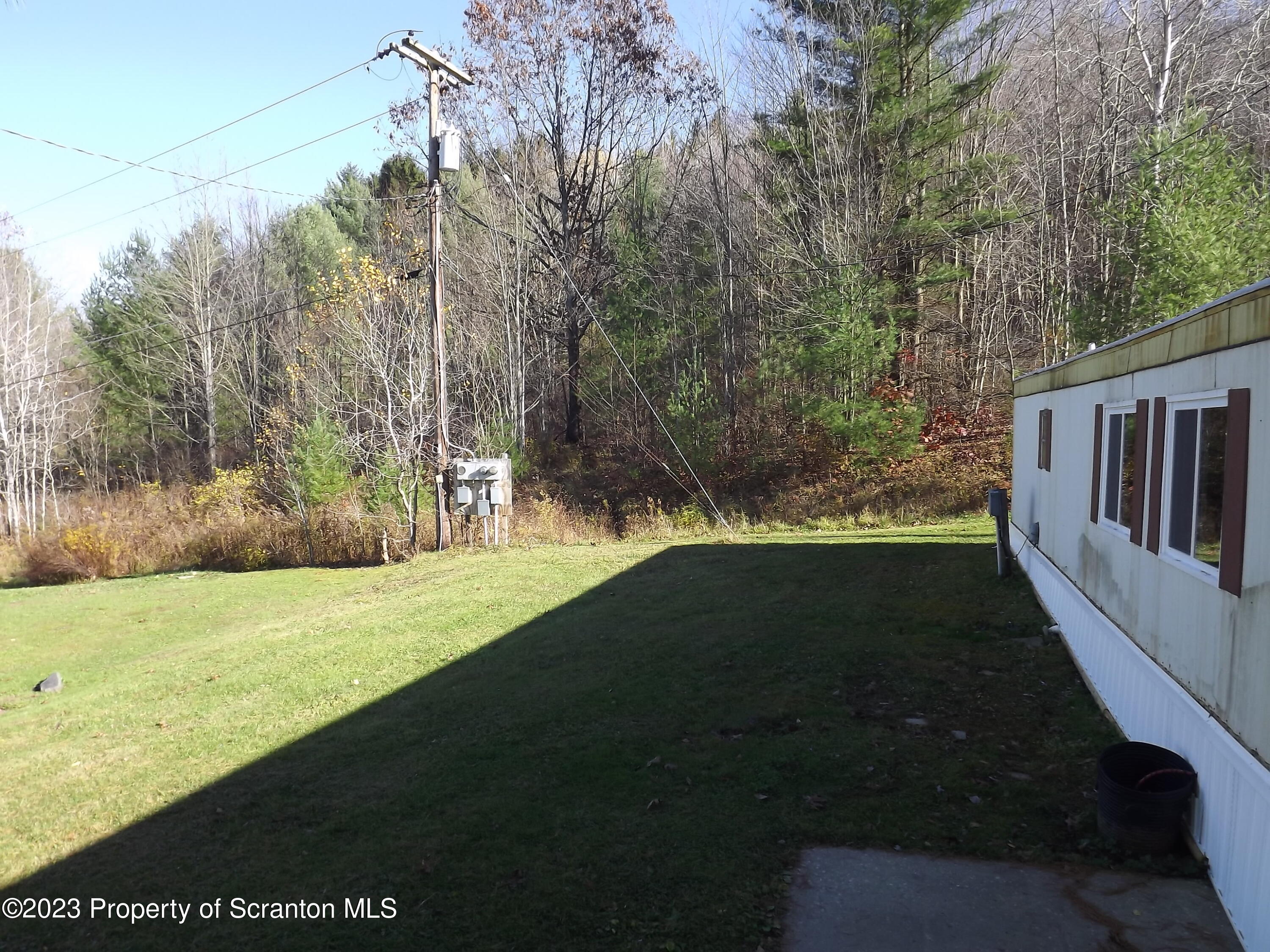 940 Nowlan Road, Unit 43 Port Crane, NY 13833 - Photo 13 of 13 a view of outdoor space with deck and yard