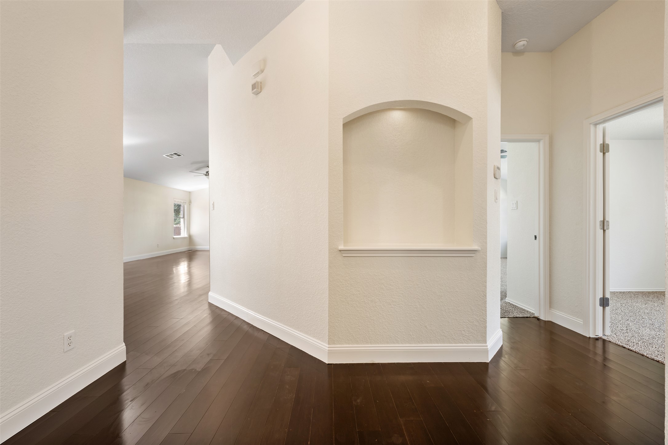 14316 Marathon Road Austin, TX 78717 - Photo 9 of 40 Rich bamboo floors contrast beautifully with light walls and an elegant built-in art niche.