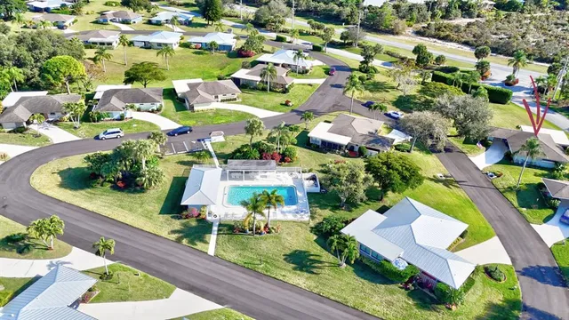 an aerial view of residential houses with outdoor space