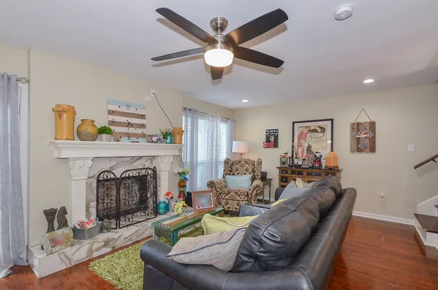 a living room with furniture and a fireplace