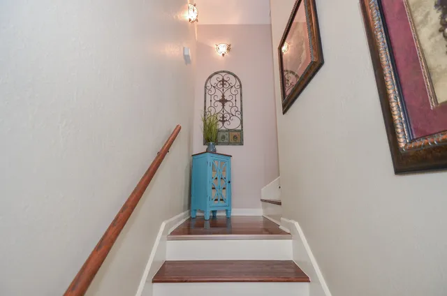 a view of staircase with a rug