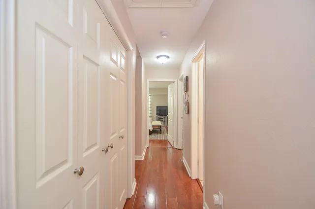 a patio with a table and chairs under an umbrella