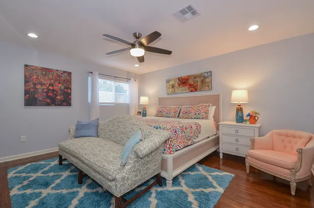 a bedroom with a bed and a couch