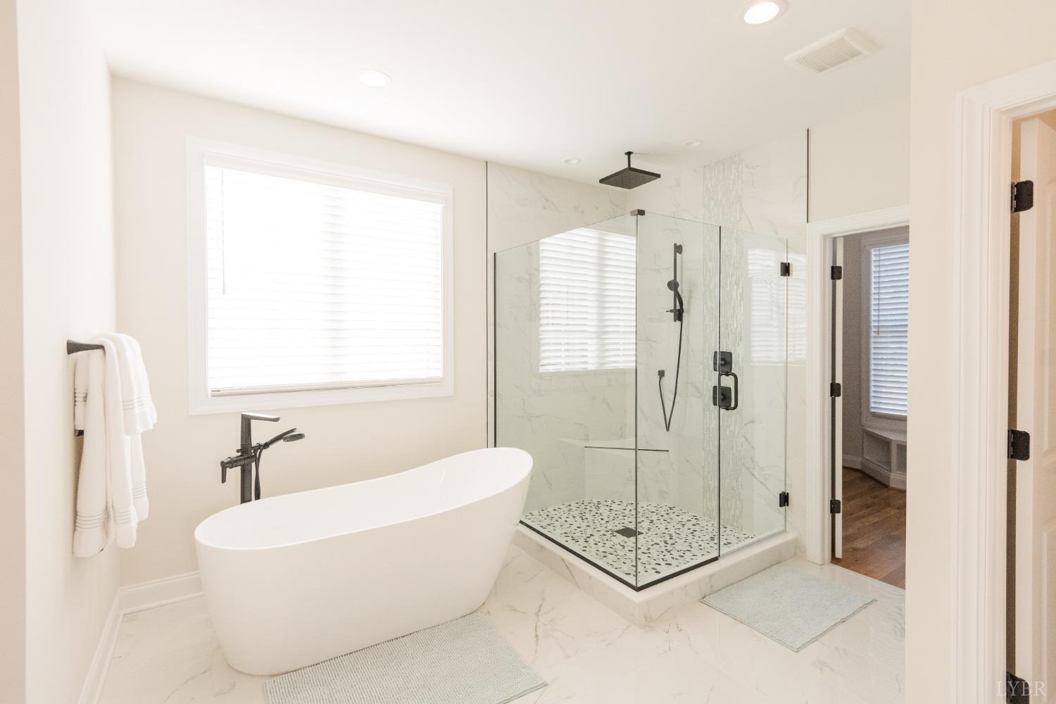 1401 Smartview Lane Forest, VA 24551 - Photo 24 of 46 a bathroom with a tub shower and window