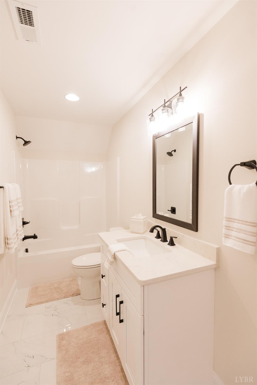 1401 Smartview Lane Forest, VA 24551 - Photo 27 of 46 a bathroom with a sink a toilet and shower