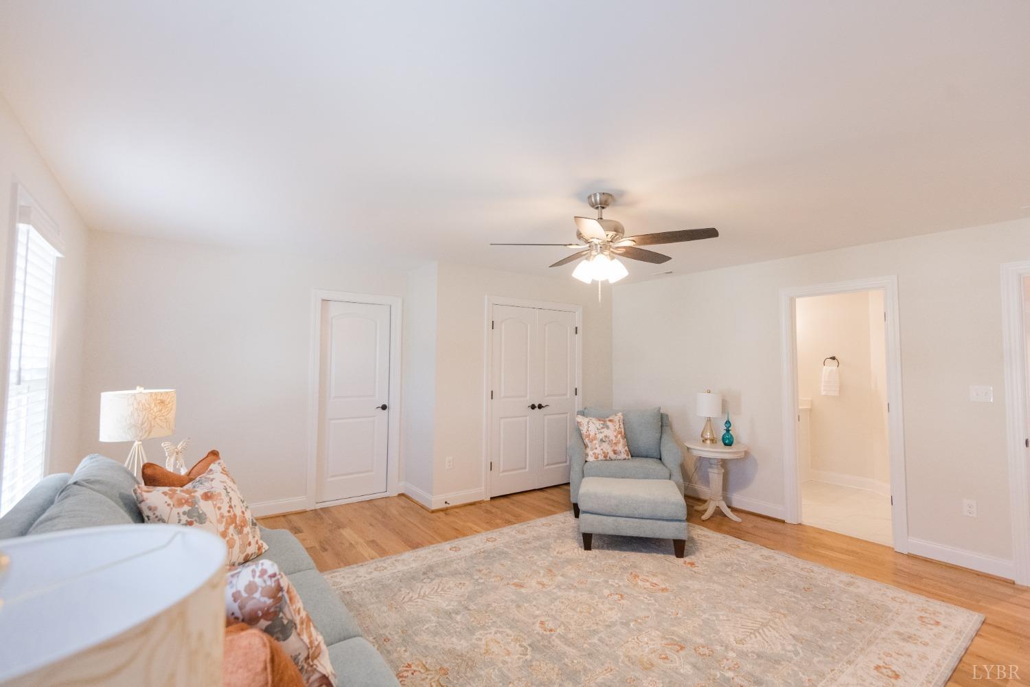 1401 Smartview Lane Forest, VA 24551 - Photo 29 of 46 a bedroom with a bed and a chandelier