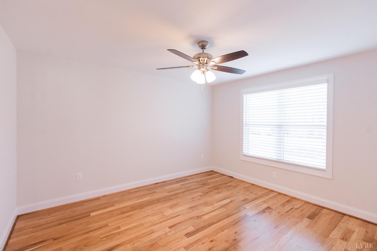 1401 Smartview Lane Forest, VA 24551 - Photo 32 of 46 an empty room with a window and a fan