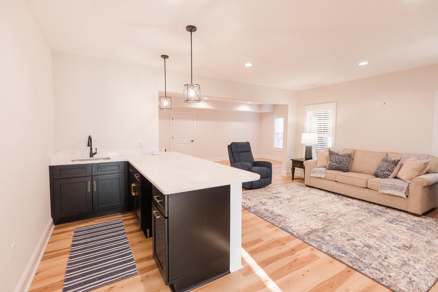 1401 Smartview Lane Forest, VA 24551 - Photo 34 of 46 a living room with furniture a sink and a chandelier