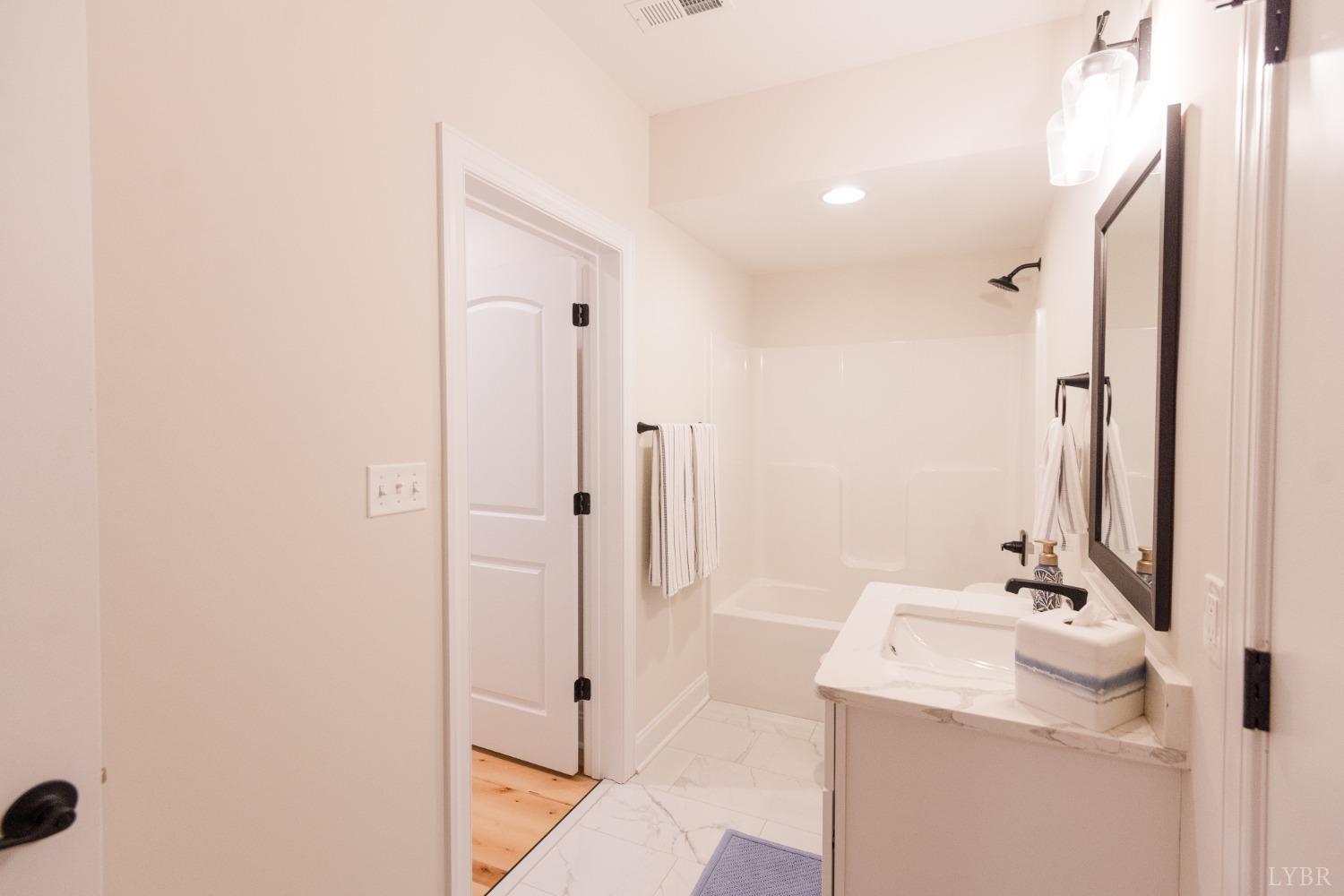 1401 Smartview Lane Forest, VA 24551 - Photo 39 of 46 a bathroom with a sink a toilet and shower