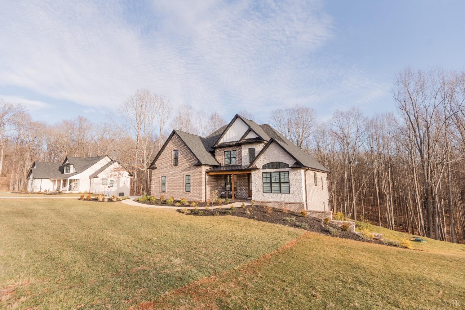 1401 Smartview Lane Forest, VA 24551 - Photo 4 of 46 a view of a house with a big yard and large trees