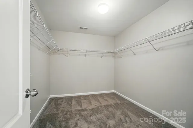 a view of a room with racks on the wall