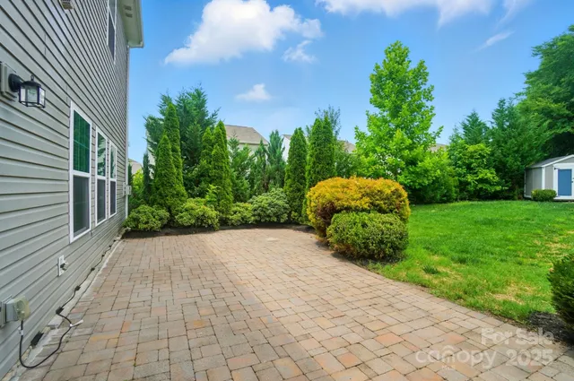 a view of backyard with garden and entertaining space